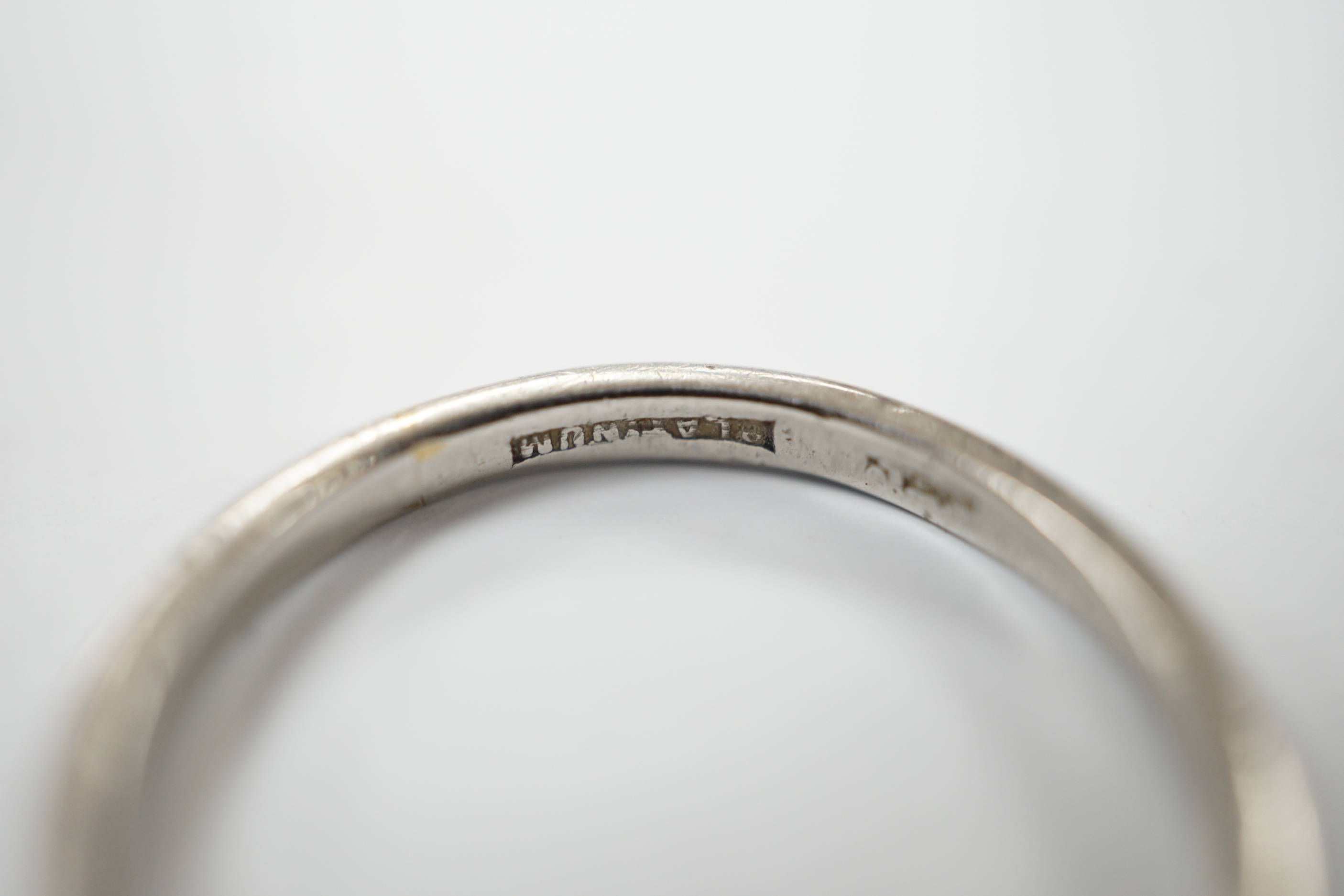 A white metal (stamped platinum) wedding band, size M/N, 3.2 grams.